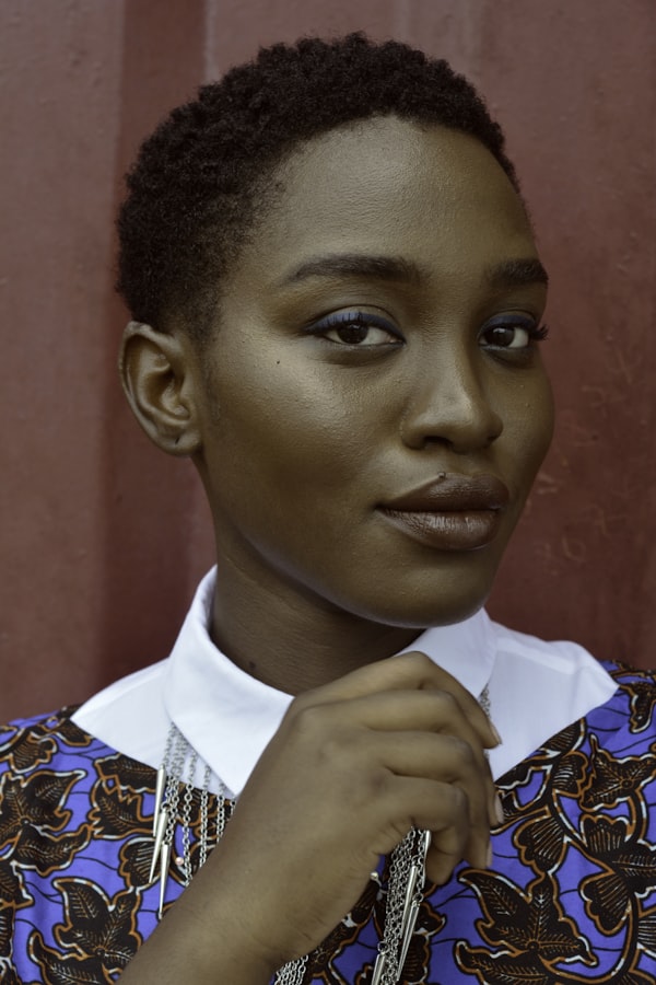 Mara Osei, warm smile, dark curly hair